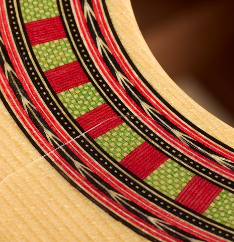 The detail in the mosaic of the rosette of a 2026 Wolfgang Jellinghaus "Flamenca Negra" guitar made of spruce and African rosewood