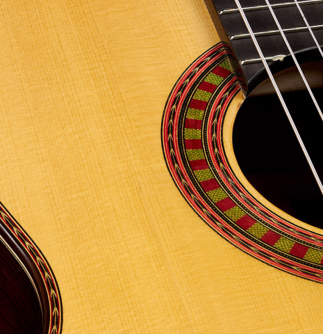 The top and rosette of a 2024 Wolfgang Jellinghaus "Flamenca Negra" flamenco guitar with spruce and Indian rosewood
