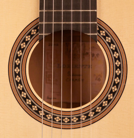 The rosette of a Loriente "Carmen" flamenco guitar made with spruce top and cypress back and sides