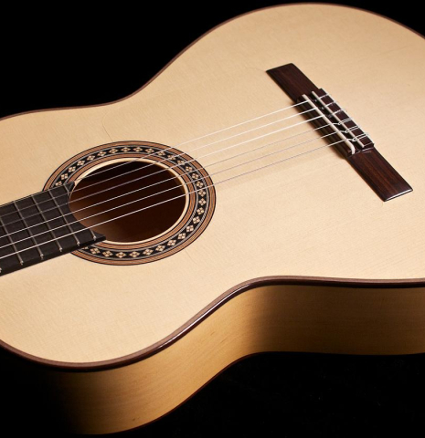The front of a Loriente "Carmen" flamenco guitar made with spruce top and cypress back and sides