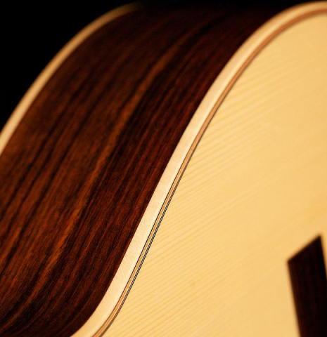 The soundboard of a Loriente &quot;Carmen Negra&quot; flamenco negra guitar made of spruce and Indian rosewood.