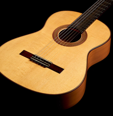 The front of a 1990 Antonio Marin Montero flamenco guitar made of spruce and cypress