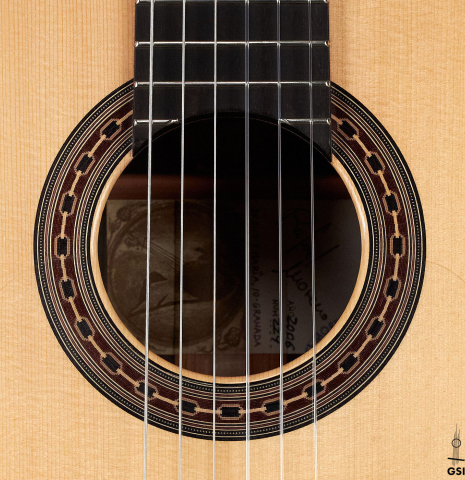 The rosette of a 2006 Rafael Moreno Rodriguez &quot;Negra&quot; flamenco guitar made of spruce and CSA rosewood.