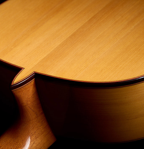 The heel, back binding and purfling of a 2026 Teodoro Perez "Flamenco Blanca" guitar made of spruce and cypress