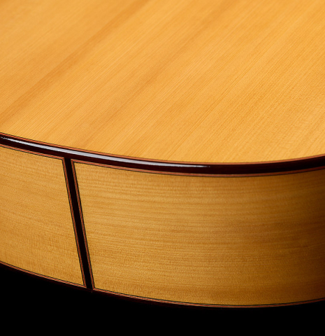 The back and sides at the foot of a 2026 Teodoro Perez "Flamenco Blanca" guitar made of spruce and cypress
