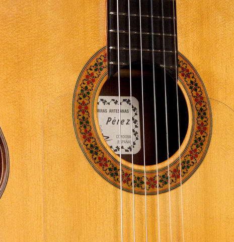 The soundboard and rosette of a 2013 Graciliano Perez "Negra" flamenco guitar (ex Fareed Haque) made of spruce and Honduran rosewood