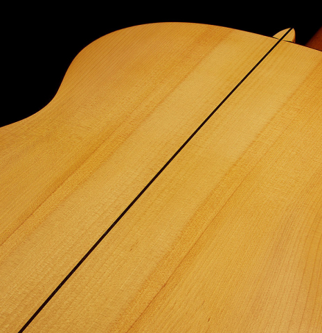 The back center seam of a 1999 Jose Marin Plazuelo flamenco guitar made of spruce and cypress
