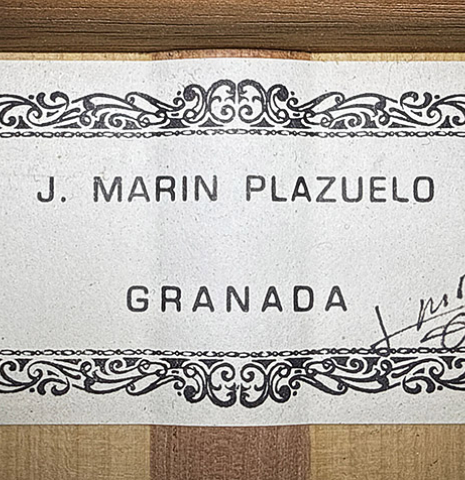 The label of a 1999 Jose Marin Plazuelo flamenco guitar made of spruce and cypress