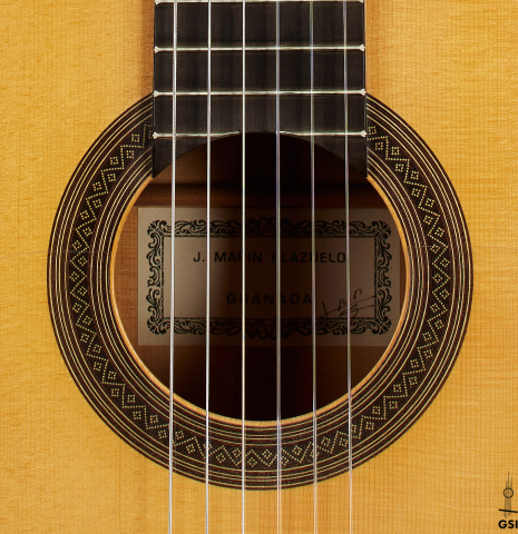 The rosette of a 1999 Jose Marin Plazuelo flamenco guitar made of spruce and cypress