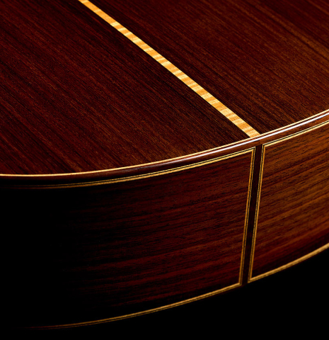 The back and sides at the foot of a 2014 Jose Marin Plazuelo "Negra" flamenco guitar made of spruce and Indian rosewood