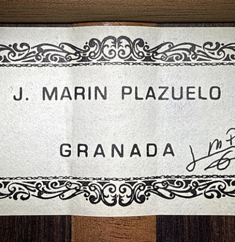 The label of a 2014 Jose Marin Plazuelo "Negra" flamenco guitar made of spruce and Indian rosewood