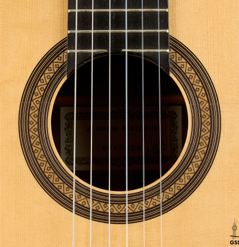 The rosette of a 2014 Jose Marin Plazuelo "Negra" flamenco guitar made of spruce and Indian rosewood