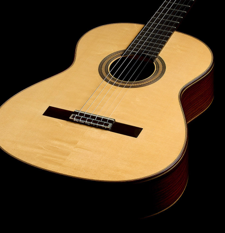 The soundboard and sides of a 2014 Jose Marin Plazuelo "Negra" flamenco guitar made of spruce and Indian rosewood
