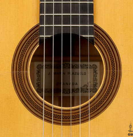 The rosette of a 1994 Jose Marin Plazuelo flamenco guitar made of spruce and cypress
