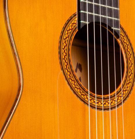 The soundboard and rosette of a 1965 Jose Ramirez "1aF AM" flamenco guitar made of cedar and cypress