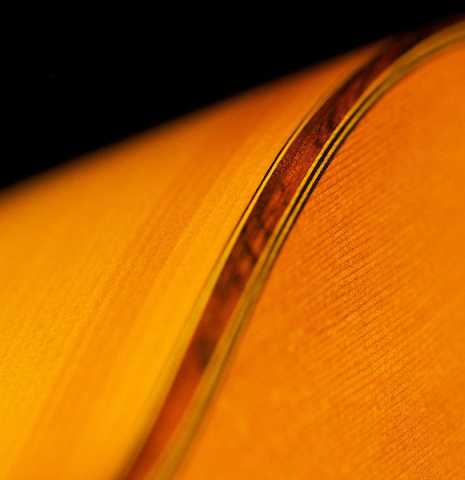 The top, side and binding of a 1965 Jose Ramirez "1aF AM" flamenco guitar made of cedar and cypress