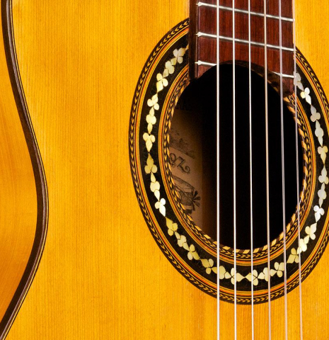 The soundboard and rosette of a c. 1912 Manuel Ramirez flamenco guitar made with spruce and cypress