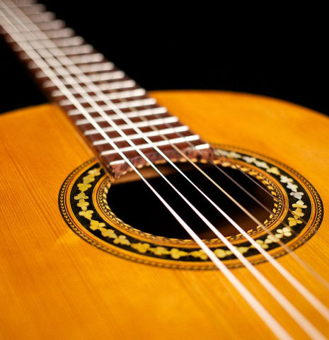 The soundboard and rosette of a c. 1912 Manuel Ramirez flamenco guitar made with spruce and cypress