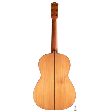 The back of a 1916 Viuda de Manuel Ramirez flamenco guitar made with spruce and cypress and pegs
