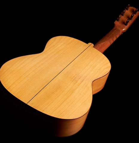 The back and sides of a 1916 Viuda de Manuel Ramirez flamenco guitar made with spruce and cypress and pegs