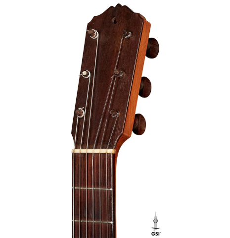 The headstock of a 1916 Viuda de Manuel Ramirez flamenco guitar made with spruce and cypress and pegs
