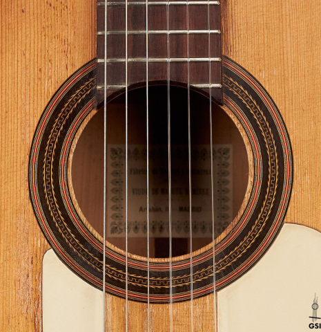 The rosette of a 1916 Viuda de Manuel Ramirez flamenco guitar made with spruce and cypress and pegs