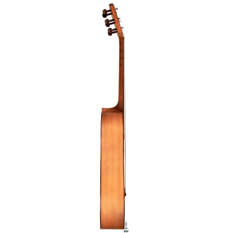 The side of a 1916 Viuda de Manuel Ramirez flamenco guitar made with spruce and cypress and pegs