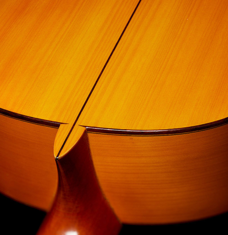 The heel, back binding and purfling of a 1970 Jose Ramirez "1aF AM" flamenco guitar made of cedar and cypress