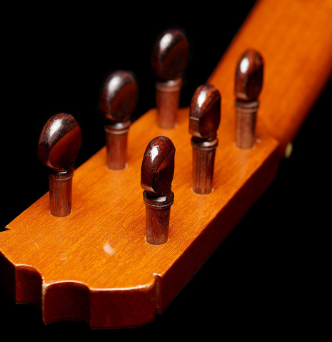 The traditional wooden pegs of a 1970 Jose Ramirez "1aF AM" flamenco guitar made of cedar and cypress
