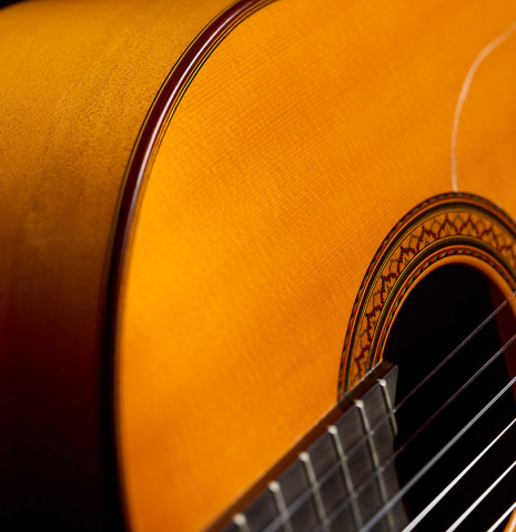 The side, top and fingerboard of a 1964 Jose Ramirez "1aF MM" flamenco guitar made of spruce and cypress