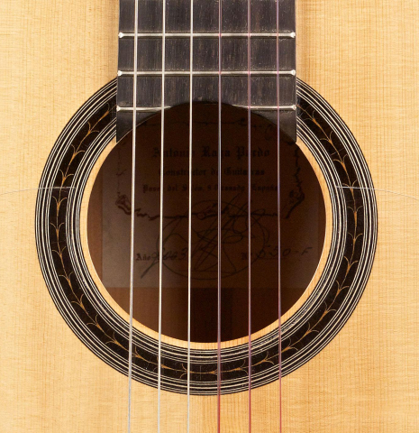 The rosette of a 2003 Antonio Raya Pardo flamenco guitar made with spruce top and cypress back and sides