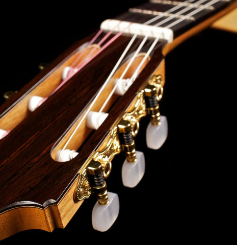 The headstock and machine heads of a 2003 Antonio Raya Pardo flamenco guitar made with spruce top and cypress back and sides