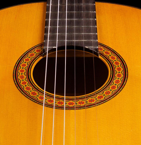 The soundboard and rosette of a 1976 Manuel Reyes flamenco blanca guitar made of spruce and cypress