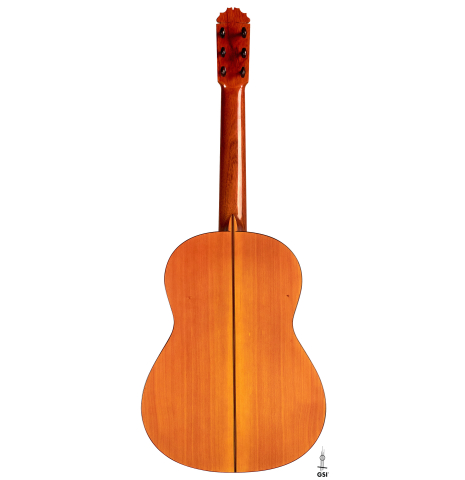 The back of a 1974 Manuel Reyes flamenco guitar made of spruce and cypress with traditional pegs