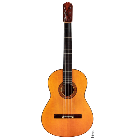 The front of a 1974 Manuel Reyes flamenco guitar made of spruce and cypress with traditional pegs