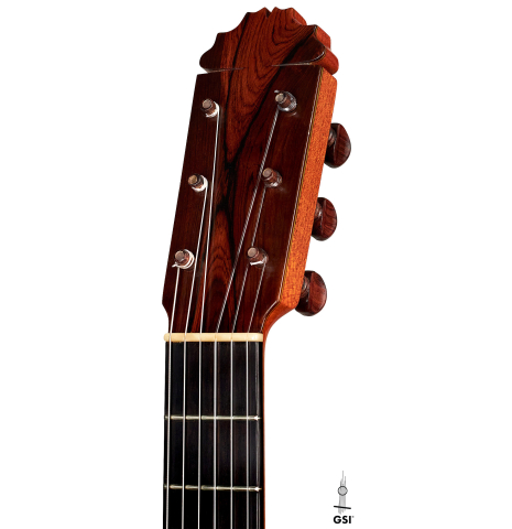 The headstock and tuners of a 1974 Manuel Reyes flamenco guitar made of spruce and cypress with traditional pegs