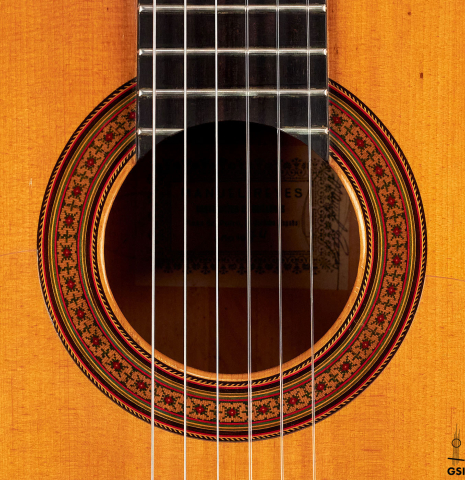 The rosette of a 1974 Manuel Reyes flamenco guitar made of spruce and cypress with traditional pegs
