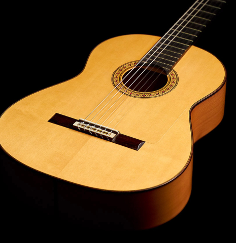 The front of a 2007 Manuel Reyes flamenco guitar made of spruce and cypress