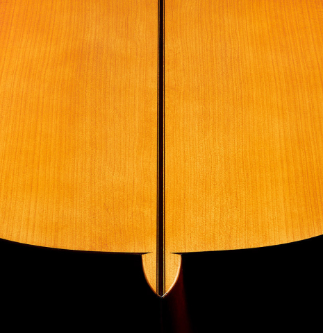 The heel and back center seam of a 1997 Manuel Reyes flamenco guitar made of spruce and cypress