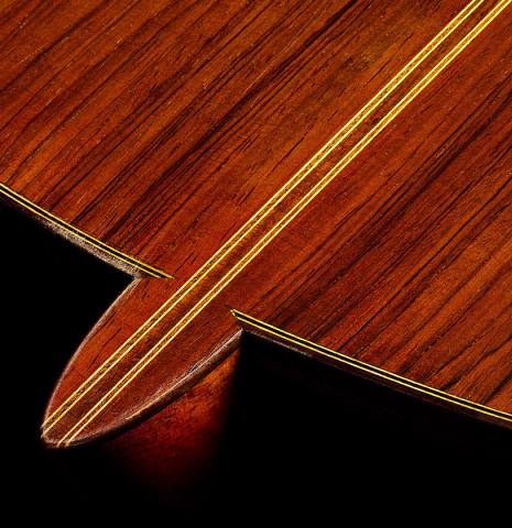 The heel, back binding and purfling of a 2003 Manuel Reyes "Negra" flamenco guitar made of spruce and CSA rosewood