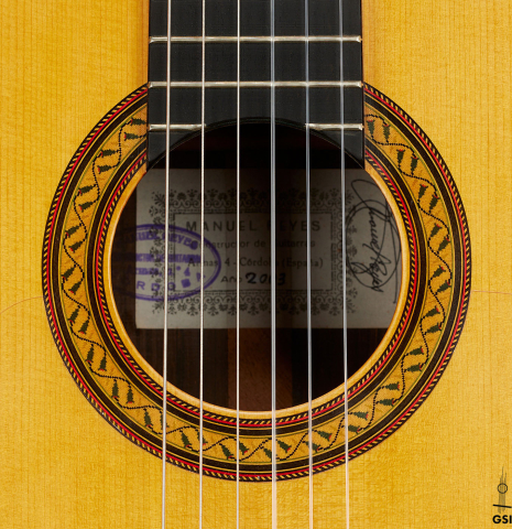 The rosette of a 2003 Manuel Reyes "Negra" flamenco guitar made of spruce and CSA rosewood