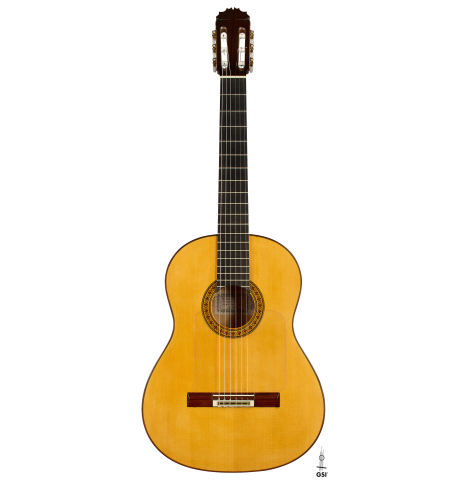 The front of a 1992 Manuel Reyes flamenco blanca guitar made of spruce and cypress