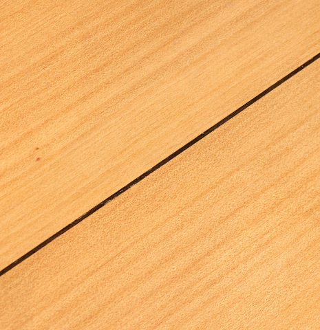 The back of a 1953 Miguel Rodriguez flamenco guitar made of spruce and cypress