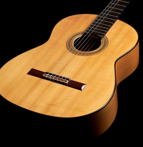 The front of a 1990 Miguel Rodriguez flamenco guitar made with spruce top and cypress back and sides.