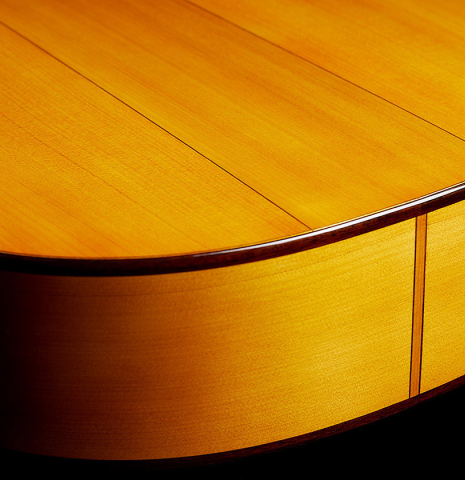 The back and sides at the foot of a 2024 Rojas &amp; Sanzol flamenco guitar made of spruce and cypress