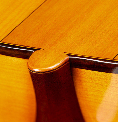 The heel, back binding and purfling of a 2024 Rojas &amp; Sanzol flamenco guitar made of spruce and cypress