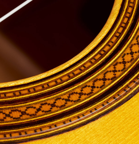 Closeup detail of the rosette of a 2024 Rojas &amp; Sanzol flamenco guitar made of spruce and cypress