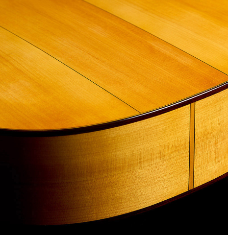 The back and sides at the foot of a 2025 Rojas &amp; Sanzol flamenco guitar made of spruce and cypress