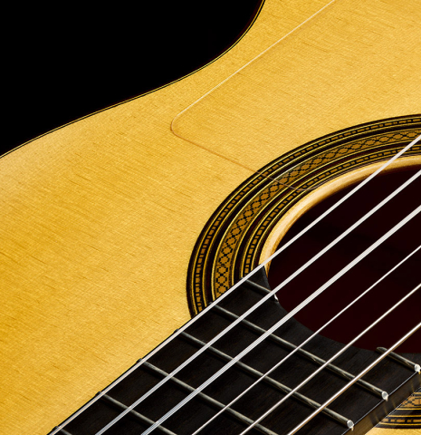 The soundboard, tap plate and rosette of a 2025 Rojas &amp; Sanzol flamenco guitar made of spruce and cypress