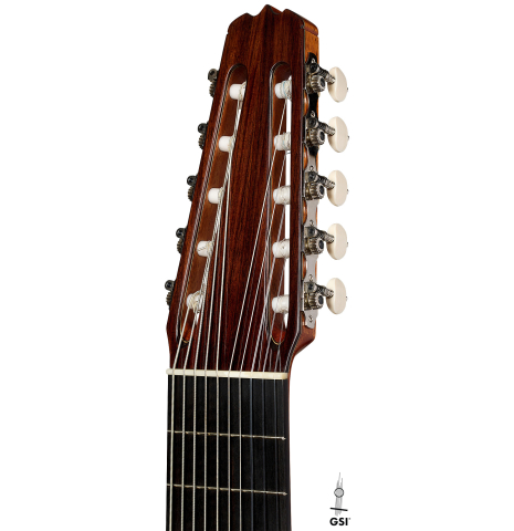 The headstock of a 2025 Rojas &amp; Sanzol "10-string" classical guitar made of cedar and Indian rosewood